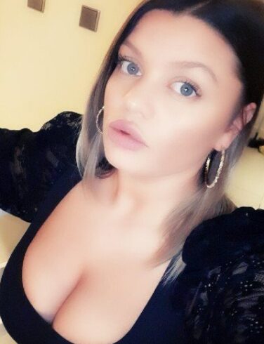 Alina busty escort in Amsterdam offering high-class companionship